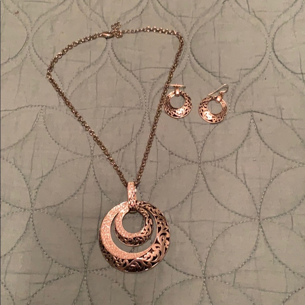 Matching silver statement necklace and earrings